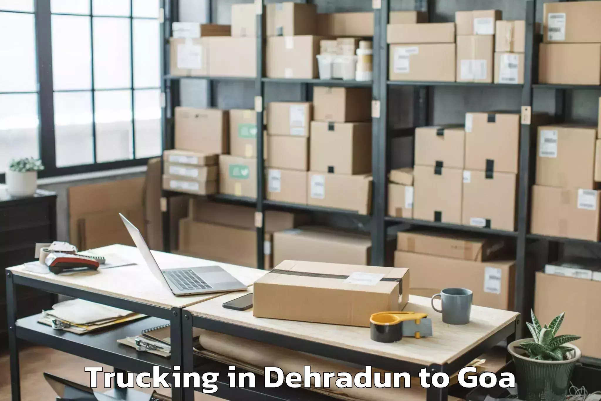 Book Dehradun to Valpoi Trucking Online